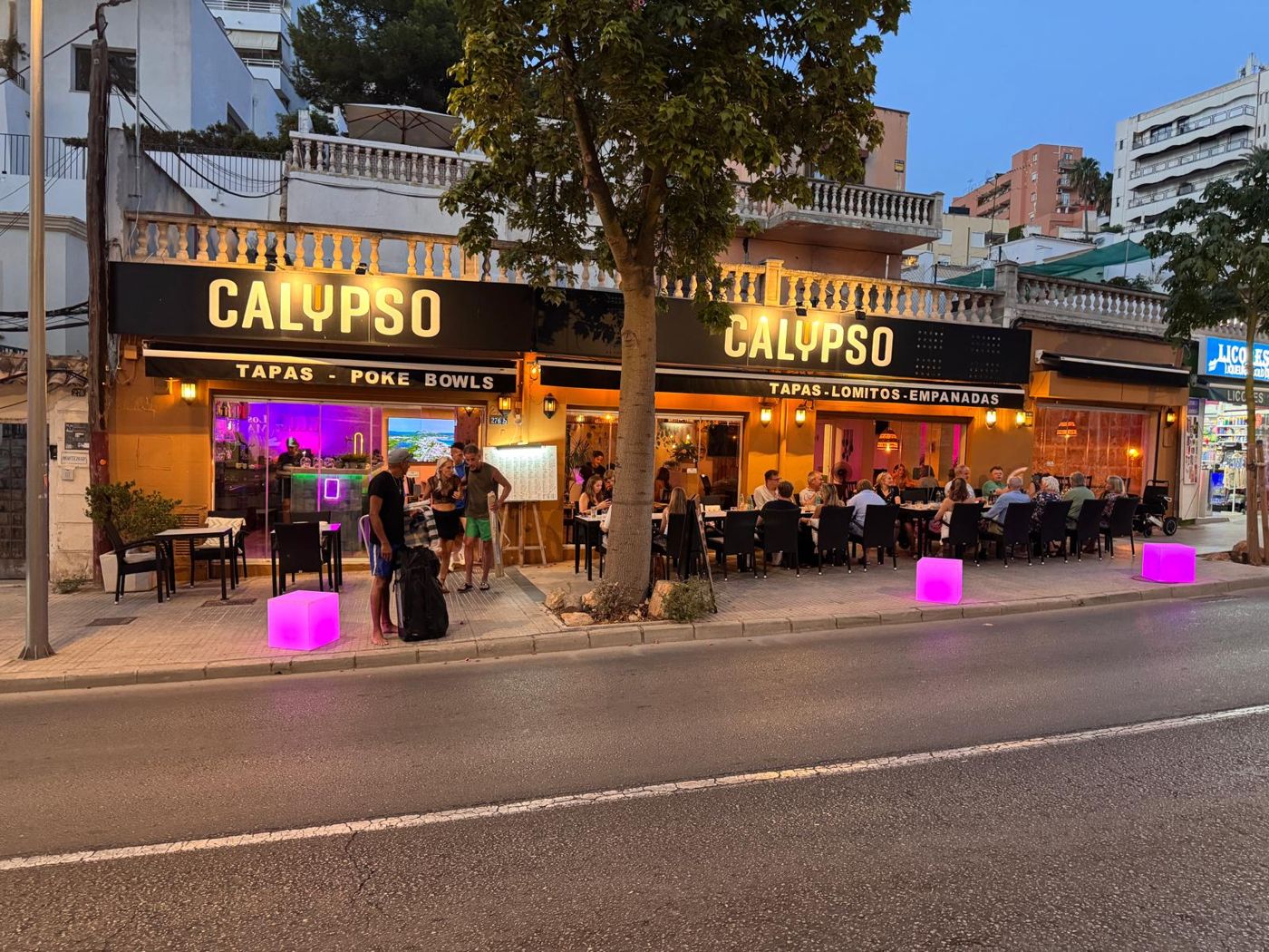 Calypso's terraces on Avinguda Joan Miró at dusk